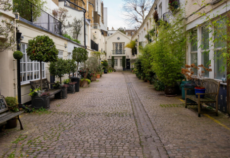 Cobbled residential mews with traditional homes and greenery in Hammersmith, London