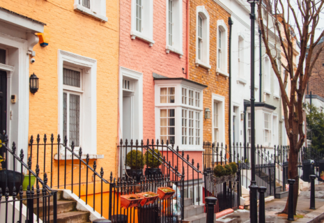 Colourful period terraced houses on a residential street in Notting Hill, London