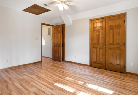 Finished wooden flooring installed in a bright residential room