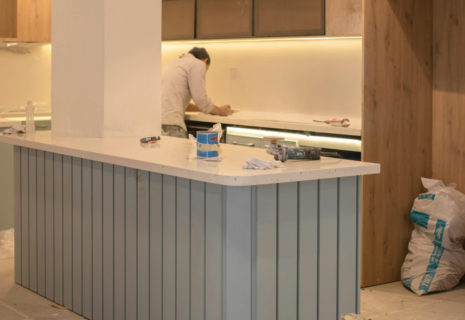 Interior finishing work during a kitchen renovation after wall preparation and plastering