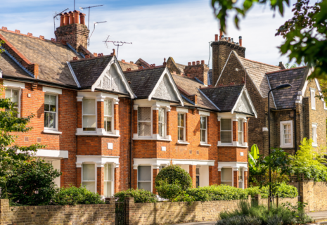 Traditional red-brick period houses with bay windows, pitched roofs and front gardens in Ealing