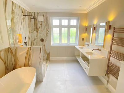 Bespoke double bathroom vanity with integrated storage and stone worktop